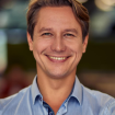vertical shot mature happy caucasian businessman blue shirt keeping arms crossed looking 1